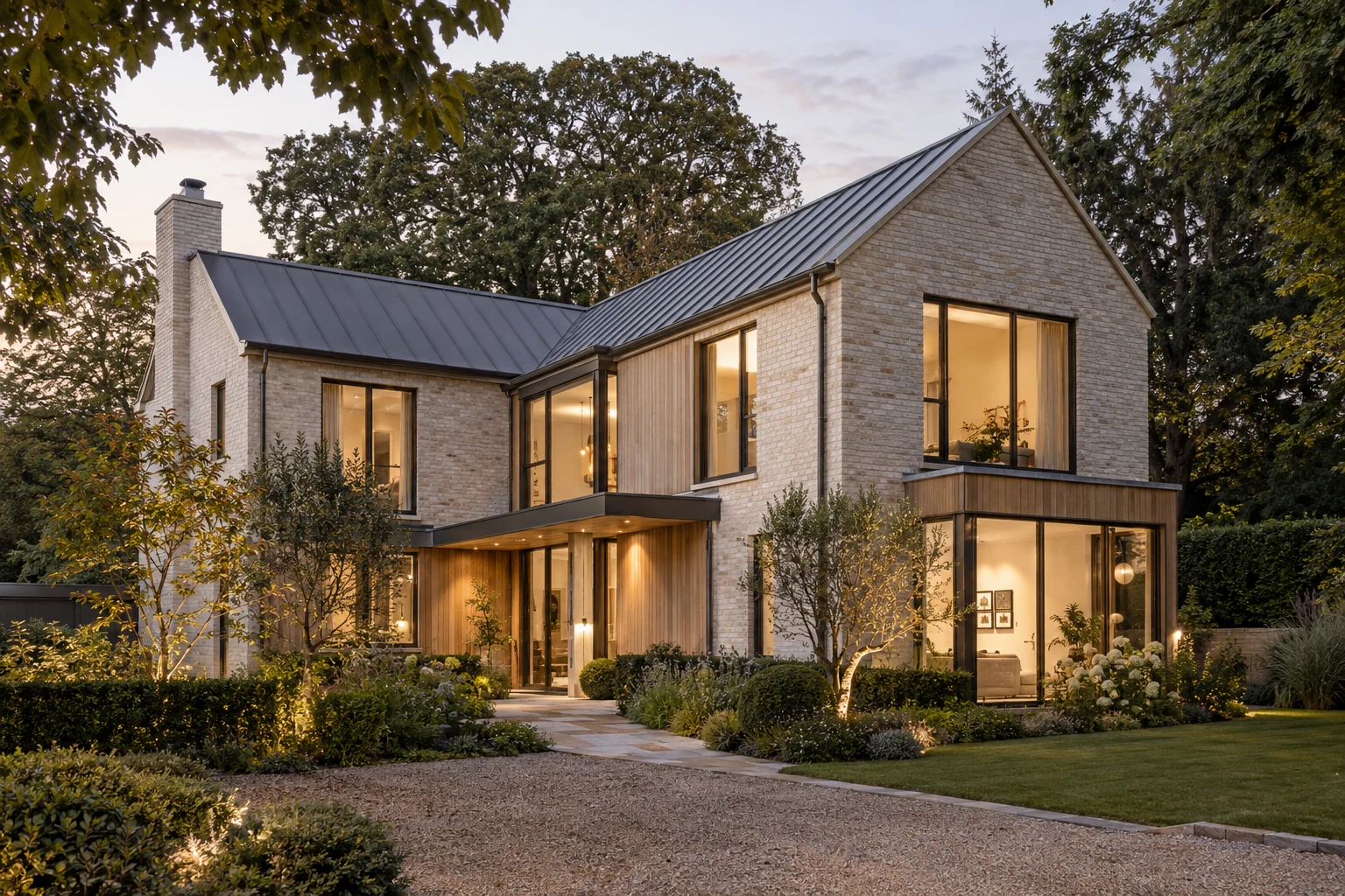 Pale-brick contemporary house with oak details, softly lit
