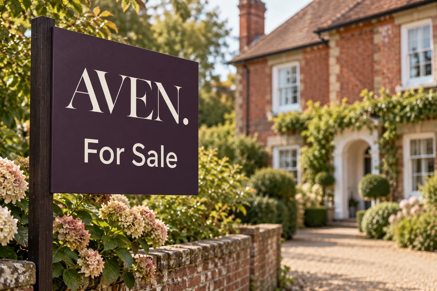 An aubergine AVEN. For Sale board beside a brick wall and a period home